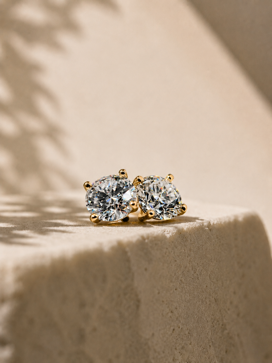 Lab-grown diamond stud earrings in warm gold settings